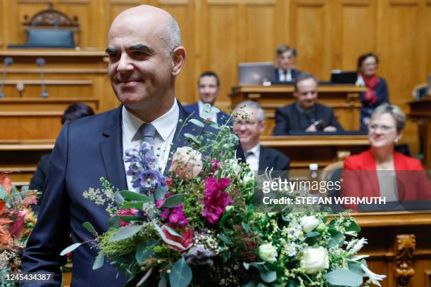 Newly elected Swiss President Alain Berset reacts after being elected during a meeting of the Federal Assembly at the House of Parliament in Bern, on...