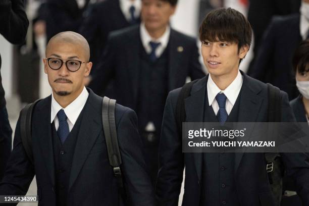 Daizen Maeda and Ao Tanaka of Japan's national football team are welcomed by fans upon their arrival at Narita International Airport in Narita, Chiba...