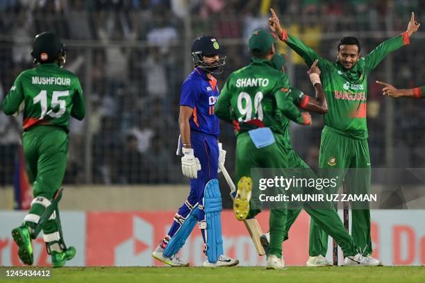 Bangladesh's Shakib Al Hasan celebrates with teammates after the dismissal of India's Washington Sundar during the second one-day international...