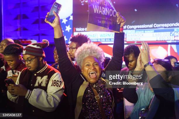 Attendees celebrate results during a runoff election night event for Raphael Warnock, a Democrat from Georgia, in Atlanta, Georgia, US, on Tuesday,...