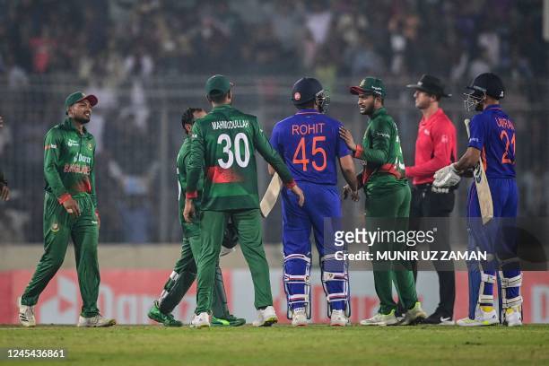 Indian's and Bangladesh's players shake hands at the end of play in the second one-day international cricket match between Bangladesh and India at...