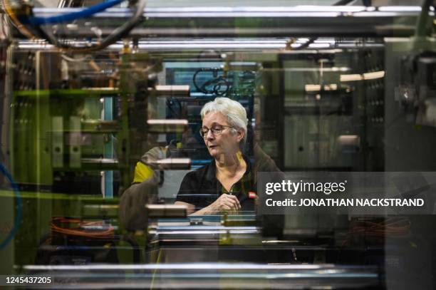 Woman works at a production line in LEGO factory on November 29 in Billund, Denmark.