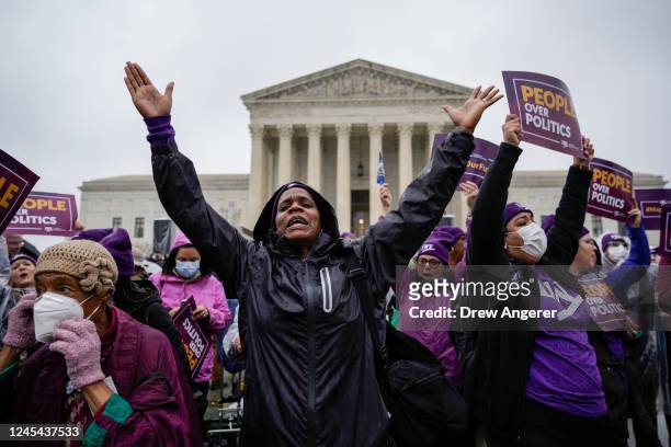 Members of the League of Women voters rally for voting rights outside the U.S. Supreme Court to hear oral arguments in the Moore v. Harper case on...