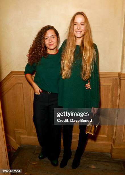 Lily Bertrand-Webb and Hum Fleming attend the Madeleine Thompson Christmas Jumper Lunch at The Pelican on December 7, 2022 in London, England.