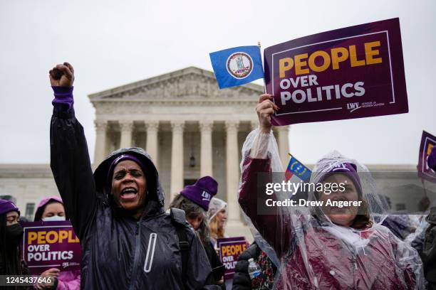 Members of the League of Women voters rally for voting rights outside the U.S. Supreme Court to hear oral arguments in the Moore v. Harper case on...