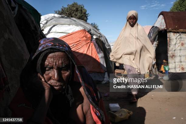 Buulaay Ibrahim an internally displaced person who fled her village due to the increades violence, sits at Limaan Camp in Mogadishu on December 6,...