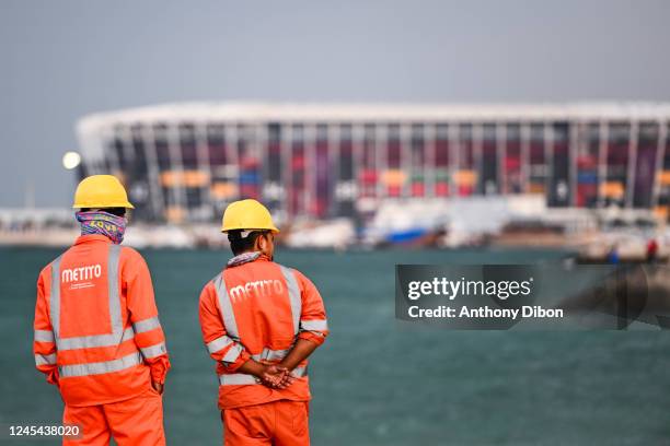 Illustration picture shows workers near the stadium 974 during the Disassembly of Stadium 974 at Stadium 974 on December 7, 2022 in Doha, Qatar.