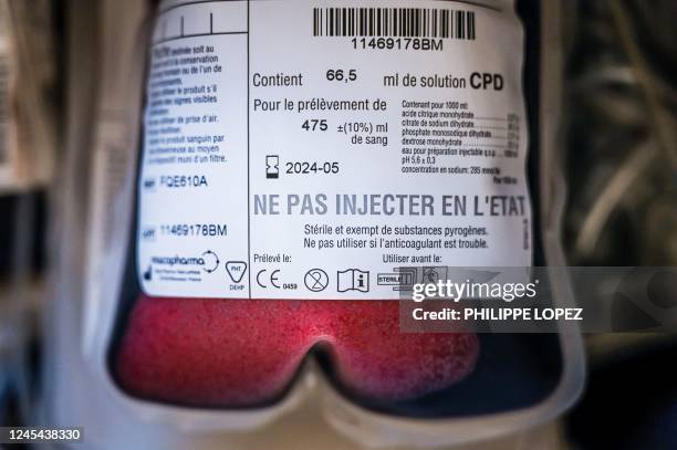 This photograph taken on December 7, 2022 shows a bag of humans' blood during a blood collection organised by the French blood agency and the...