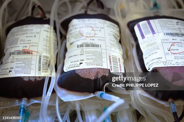 This photograph taken on December 7, 2022 shows the bags of humans' blood during a blood collection organised by the French blood agency and the...