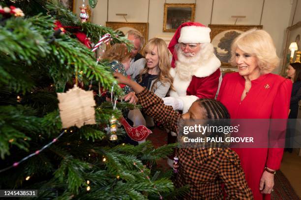 Britain's Camilla, Queen Consort reacts during her annual reception for youngsters and their carers from Helen and Douglas House and Roald Dahl's...
