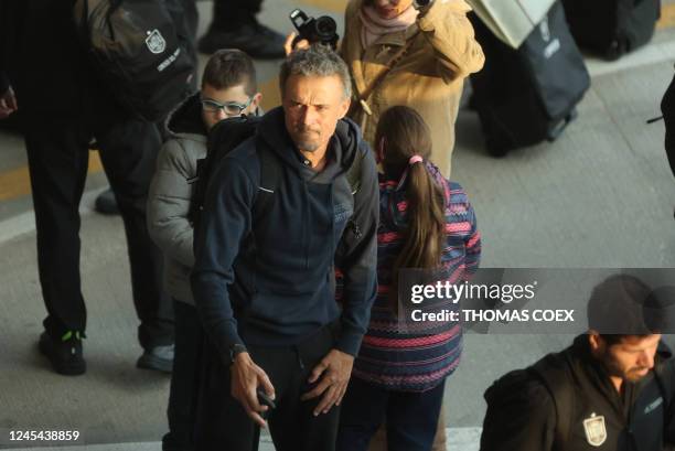 Spain's coach Luis Enrique arrives with some members of Spain team at the Adolfo Suarez Madrid-Barajas airport on the outskirts of Madrid on December...