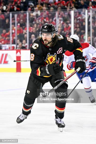 Calgary Flames Defenceman Chris Tanev chases after the puck during the second period of an NHL game between the Calgary Flames and the Montreal...