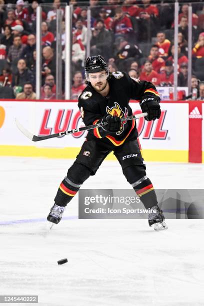 Calgary Flames Defenceman Rasmus Andersson passes the puck during the third period of an NHL game between the Calgary Flames and the Montreal...