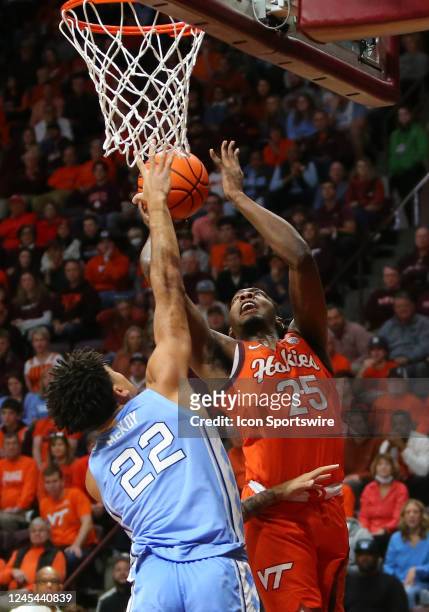 North Carolina Tar Heels forward Justin McKoy attempts to defend Virginia Tech Hokies forward Justyn Mutts during a men's college basketball game...