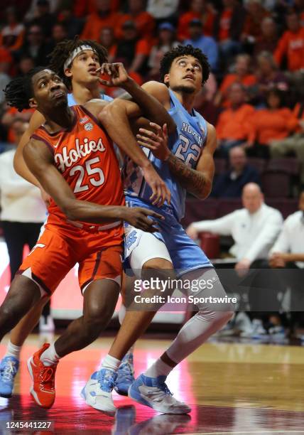 North Carolina Tar Heels forward Justin McKoy attempts to box out Virginia Tech Hokies forward Justyn Mutts during a men's college basketball game...