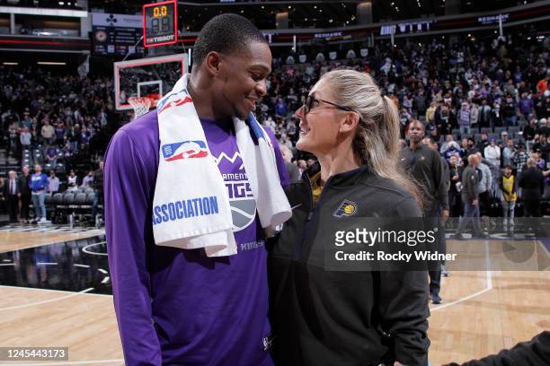 DeAaron Fox of the Sacramento Kings and Assistant coach of the Indiana Pacers Jenny Boucek talk after the Sacramento Kings defeated the Indiana...