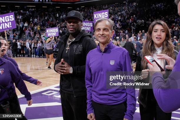 Cent, Sacramento Kings owner and chairman Vivek Ranadive, and Assistant General Manager of the G League Stockton Kings Anjali Ranadive look on after...