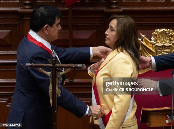 President of the Peruvian Congress Jose Williams Zapata swears in Dina Boluarte as the new President hours after former President Pedro Castillo was...