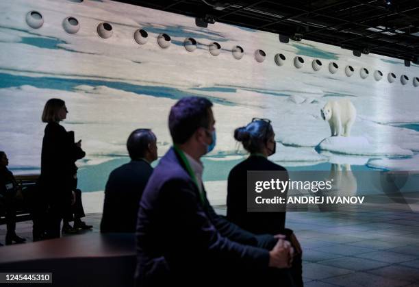 People visit the immersive video experience hosted by the National Geographic Society at a press event during the United Nations Biodiversity...