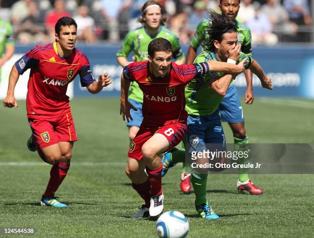 Will Johnson of Real Salt Lake battles Mauro Rosales of the Seattle Sounders FC at CenturyLink Field on September 10, 2011 in Seattle, Washington....