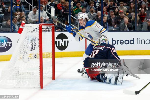 Tage Thompson of the Buffalo Sabres beats Elvis Merzlikins of the Columbus Blue Jackets for his first of four goals in the first period of the game...