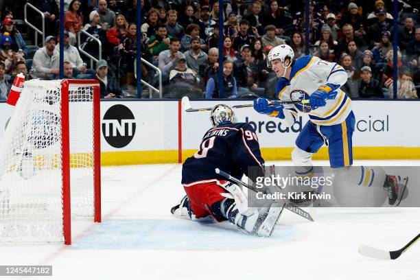 Tage Thompson of the Buffalo Sabres beats Elvis Merzlikins of the Columbus Blue Jackets for his first of four goals in the first period of the game...
