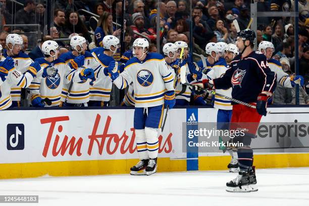 Tage Thompson of the Buffalo Sabres is congratulated by his teammates after scoring his fifth goal of the game against the Columbus Blue Jackets...