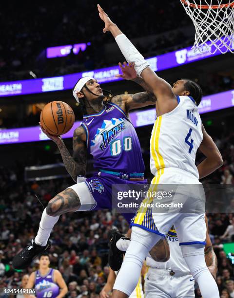 Jordan Clarkson of the Utah Jazz shoots over Moses Moody of the Golden State Warriors during the first half of the game at Vivint Arena on December...