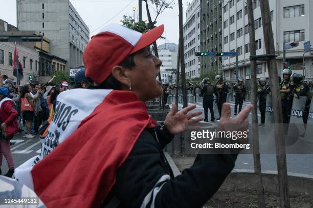 Supporters of Pedro Castillo, Peru's former president, protest his impeachment and arrest, near the Legislative Palace in Lima, Peru, on Wednesday,...