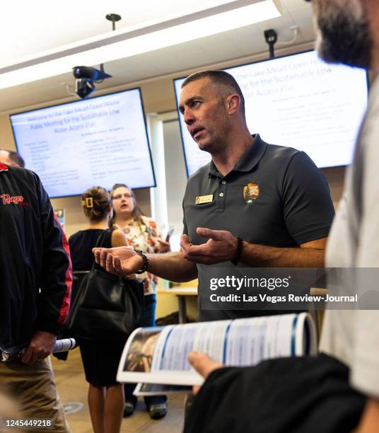 Justin Pattison, deputy superintendent of Lake Mead National Recreation Area, speaks with attendees during an open house public meeting for the...