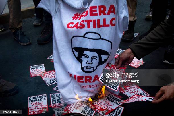 Demonstrators protest against Pedro Castillo, Peru's former president, following his impeachment and arrest, near the Lima Prefecture in Lima, Peru,...