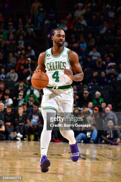 Noah Vonleh of the Boston Celtics dribbles the ball during the game against the Phoenix Suns on December 7, 2022 at Footprint Center in Phoenix,...