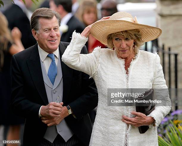Simon Elliot and Annabel Elliot attend the wedding of Ben Elliot and Mary-Clare Winwood at the church of St. Peter and St. Paul, Northleach on...