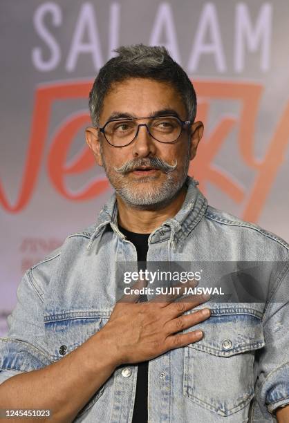 In this picture taken on December 7 Bollywood actor Aamir Khan poses for picture during the special screening of the Hindi film Salaam Venky in...