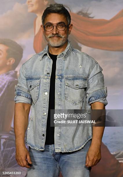 In this picture taken on December 7 Bollywood actor Aamir Khan poses for picture during the special screening of the Hindi film Salaam Venky in...