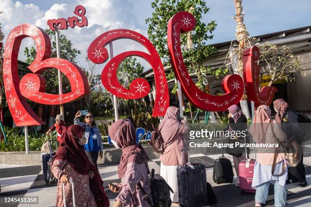 Group of local tourist gather at the domestic arrival of Ngurah Rai airport to take a group photo on December 7, 2022 in Denpasar, Bali, Indonesia....