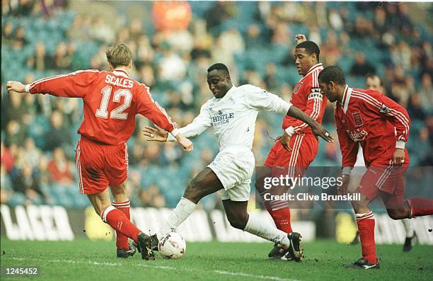 Tony Yeboah of Leeds takes on the Liverpool defence during the Leeds United v Liverpool FA Cup Quarter Final match at Elland Road, Leeds. Mandatory...