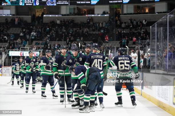 The Vancouver Canucks celebrate the overtime win against the San Jose Sharks at SAP Center on December 7, 2022 in San Jose, California.