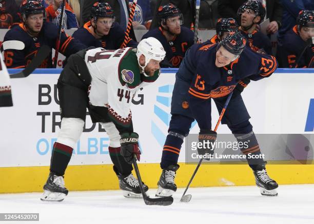 Jesse Puljujarvi of the Edmonton Oilers catching up with Zack Kassian of the Arizona Coyotes in the second period on December 7, 2022 at Rogers Place...