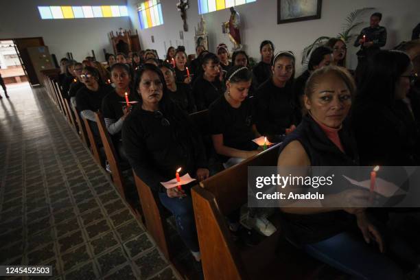 Inmates attend the celebration of 'Day of the Candles' at El Buen Pastor Women's Prison in Bogota, Colombia, on December 07, 2022. Colombian people...