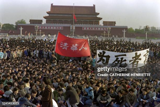 Chinese students pay hommage to former Chinese Communist Party leader and liberal reformer Hu Yaobang in Tiananmen Square after a night sit-in...