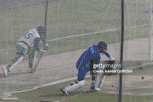 Pakistan's captain Babar Azam and teammate bat at the nets during a training session ahead of their second cricket Test match against England, at the...