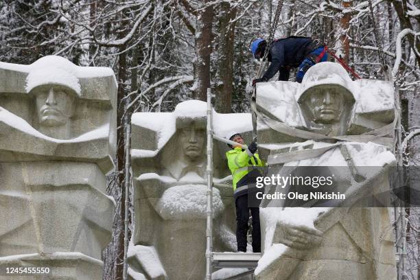 Workers dismantle the monument to Soviet Red Army soldiers at the Antakalnis Military Cemetery on December 8, 2022 in Vilnius, Lithuania.
