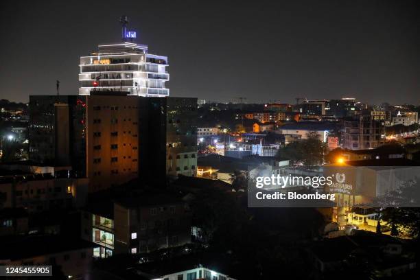 Residential and commercial buildings on the skyline at night in Accra, Ghana, on Sunday, Dec. 4, 2022. With debt interest payments eating up more...