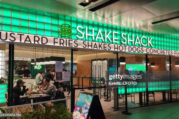 Citizens are seen at a Shake Shack burger restaurant in Shanghai, China, December 8, 2022.