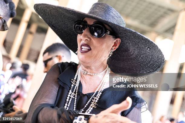 Spanish actress Rossy de Palma gestures during the luxury brand Chanels fashion show, Metiers dart, in Dakar on December 6, 2022. - For the first...