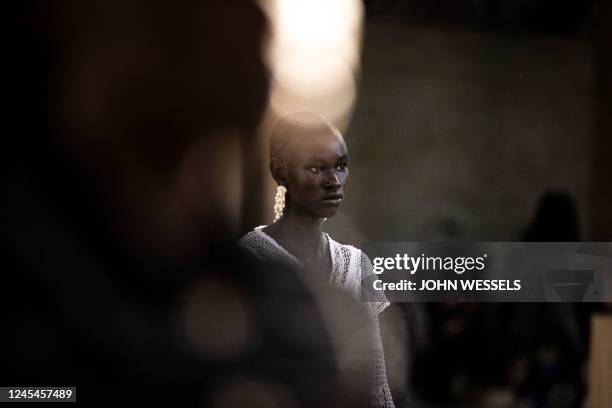 Model walks down the catwalk during the luxury brand Chanels fashion show, Metiers dart, in Dakar on December 06, 2022. - For the first time ever...