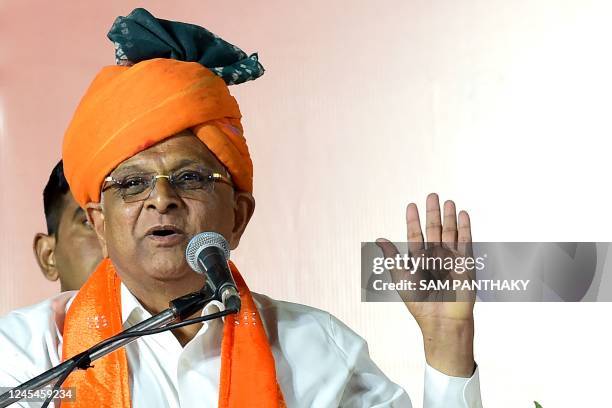 Gujarat State Chief Minister, Bhupendrabhai Patel gestures while speaking during a felicitation ceremony in Ahmedabad on December 8, 2022. - Indian...