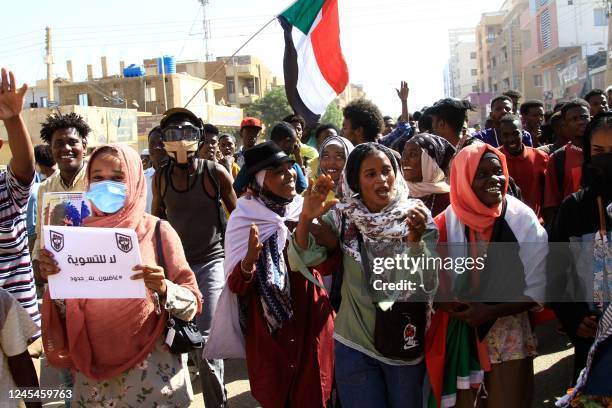 Sudanese demonstrators take to the streets of the capital Khartoum, on December 8 to protest against the initial agreement signed on December 5...