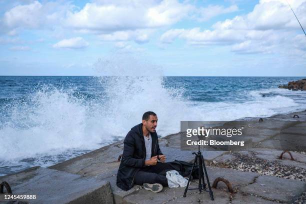 Visitor records a selfie video on the shoreline at the corniche in Alexandria, Egypt, on Tuesday, Dec. 6, 2022. Annual inflation in urban parts of...